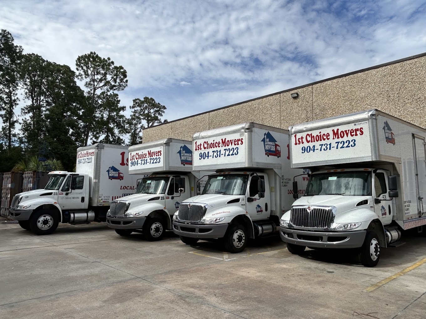1st Choice Movers crew working beside a company moving truck